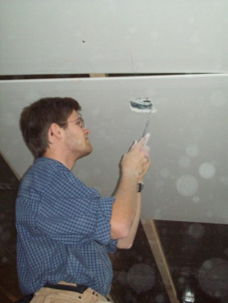 Jonathan cutting holes for the sockets
