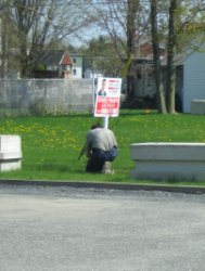 putting up the sign