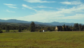 A house with mountains in the background