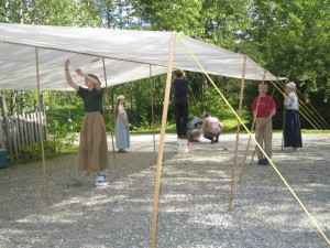 raising a makeshift tent in case of rain